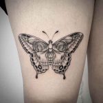 Butterfly skull tattoo